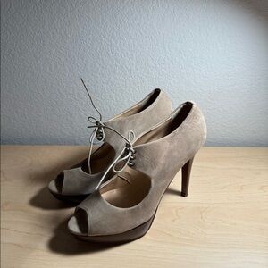 This is a pair of J. Crew tan suede open-toe lace-up pumps
Size 8